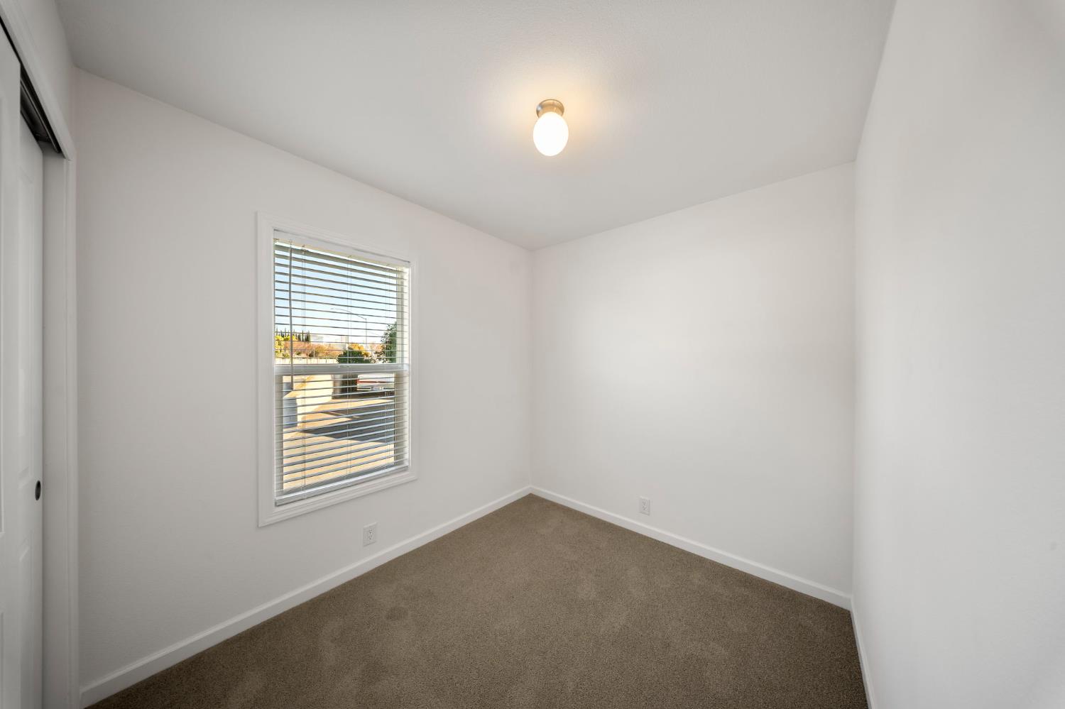 360 East Grant Line Road, Unit 19A Tracy, CA 95376 - Photo 17 of 19 an empty room with windows