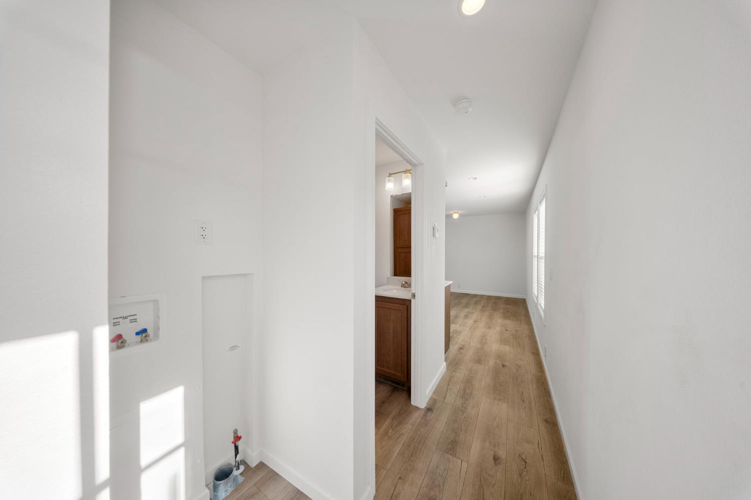 360 East Grant Line Road, Unit 19A Tracy, CA 95376 - Photo 9 of 19 a view of a hallway with wooden floor