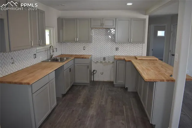 a bathroom with a sink a toilet and vanity