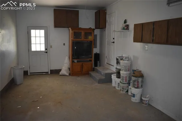 an empty room with wooden floor and closet