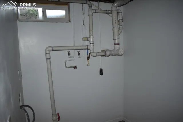 a bathroom with a granite countertop sink and a vanity