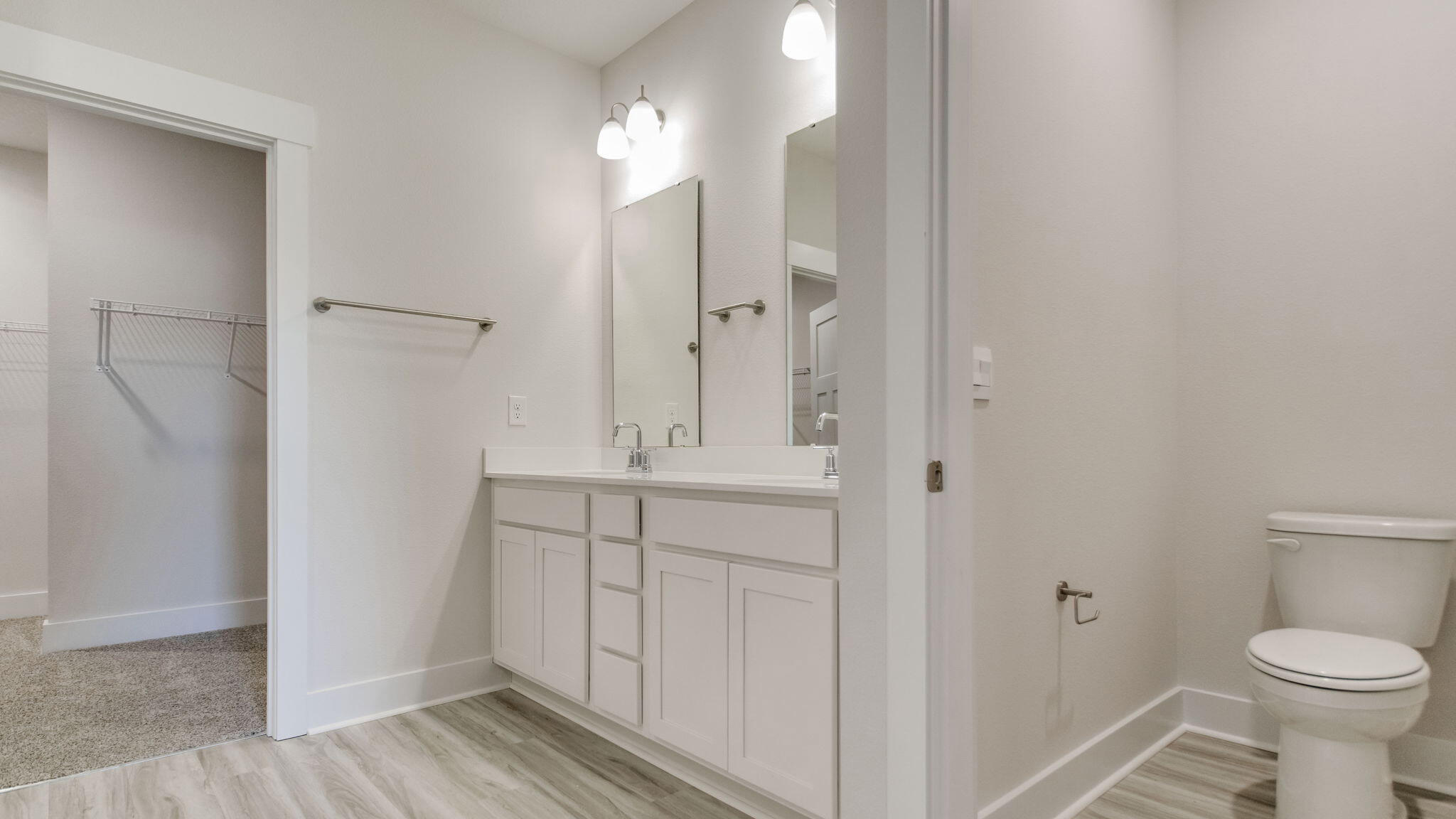 8044 Fir Tree Drive Milton, FL 32583 - Photo 19 of 32 a bathroom with a sink a toilet and shower