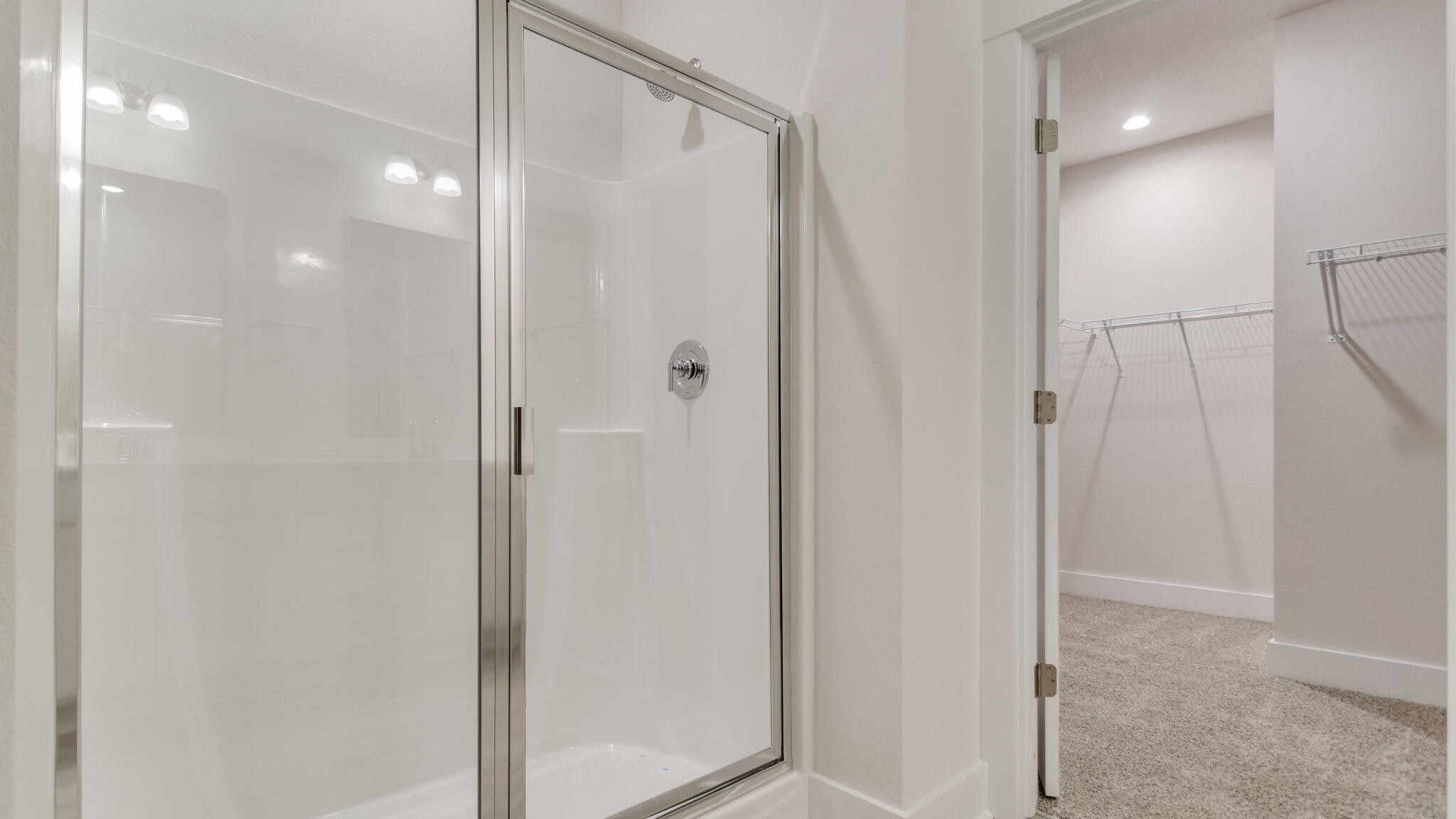 8044 Fir Tree Drive Milton, FL 32583 - Photo 20 of 32 a bathroom with a shower and a glass door