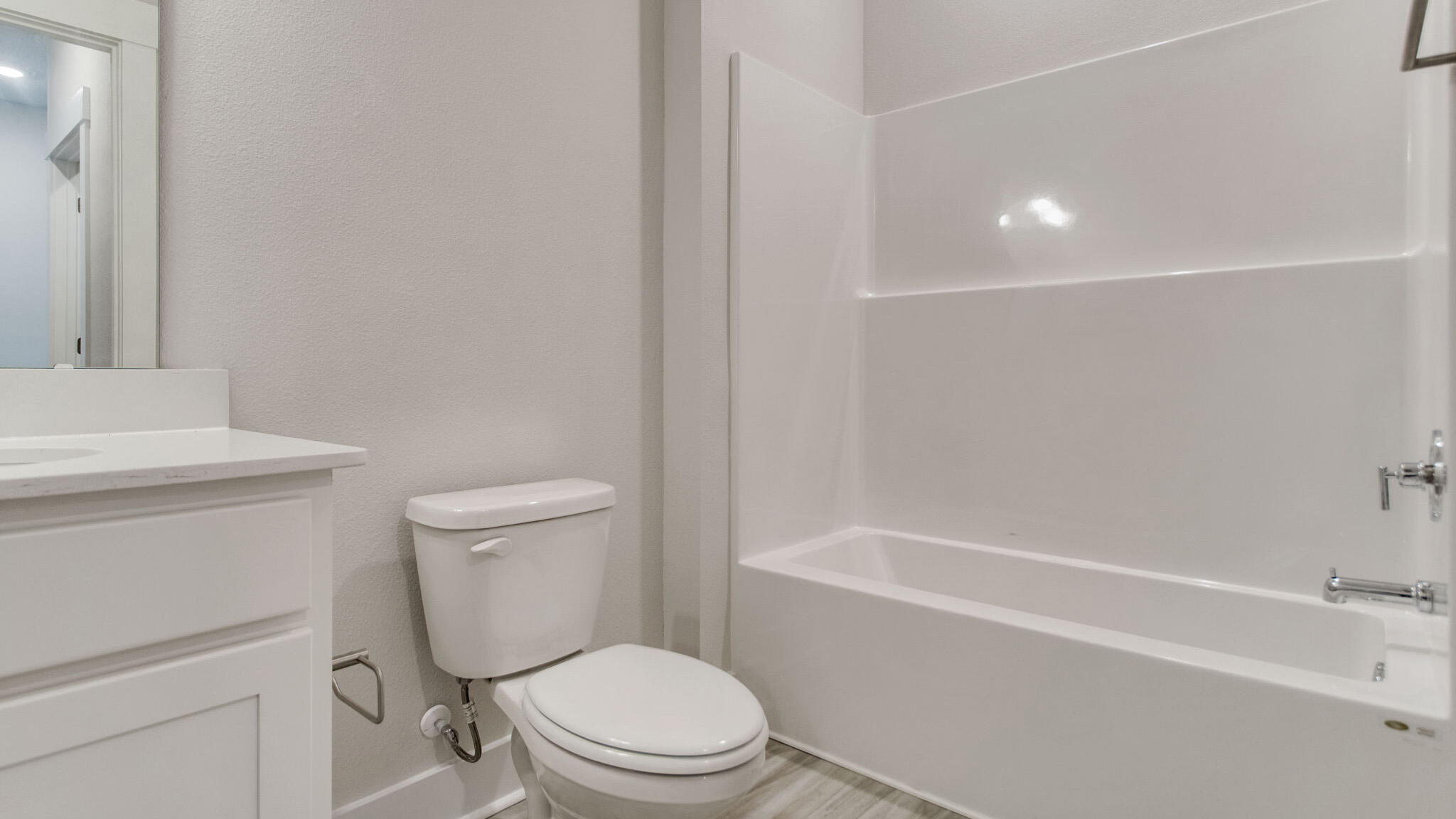 8044 Fir Tree Drive Milton, FL 32583 - Photo 31 of 32 a white toilet sitting next to a bath tub