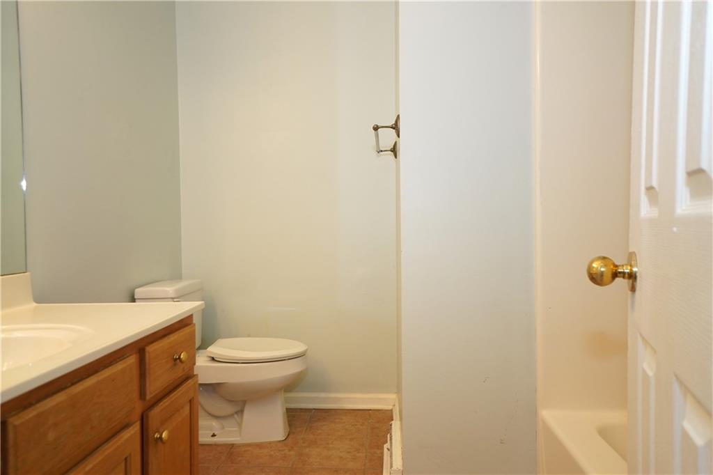 728 Mercer Street Pittsburgh, PA 15219 - Photo 22 of 27 a bathroom with a toilet a sink and a shower