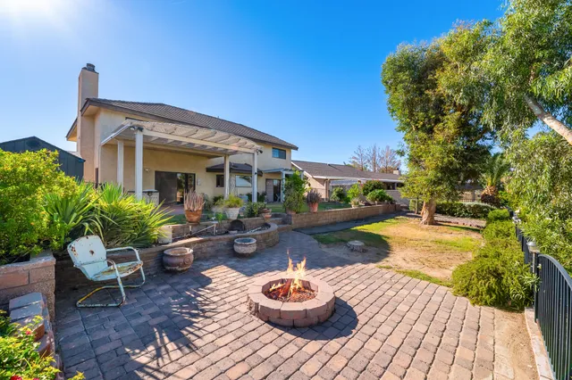 a spacious bathroom with a tub a sink and a large mirror