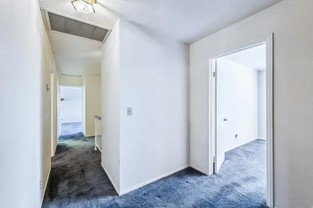 a kitchen with stainless steel appliances granite countertop a refrigerator a sink dishwasher a stove and a refrigerator