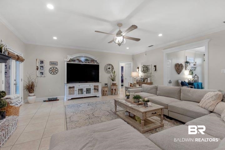 24541 Baldwin Beach Expressway Robertsdale, AL 36567 - Photo 6 of 51 Living room with tile patterned floors, recessed lighting, ceiling fan, and ornamental molding