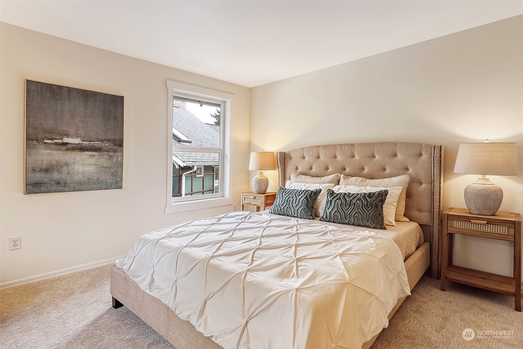 1817 20th Avenue, Unit B Seattle, WA 98122 - Photo 13 of 28 a bedroom with a large bed and a window