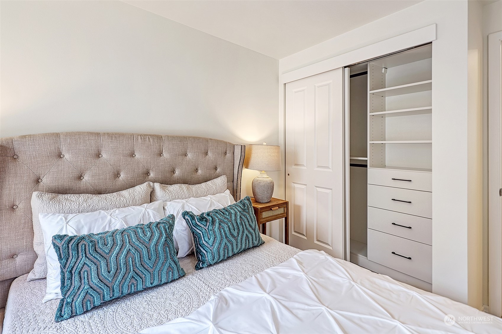 1817 20th Avenue, Unit B Seattle, WA 98122 - Photo 14 of 28 a bedroom with a bed and a window