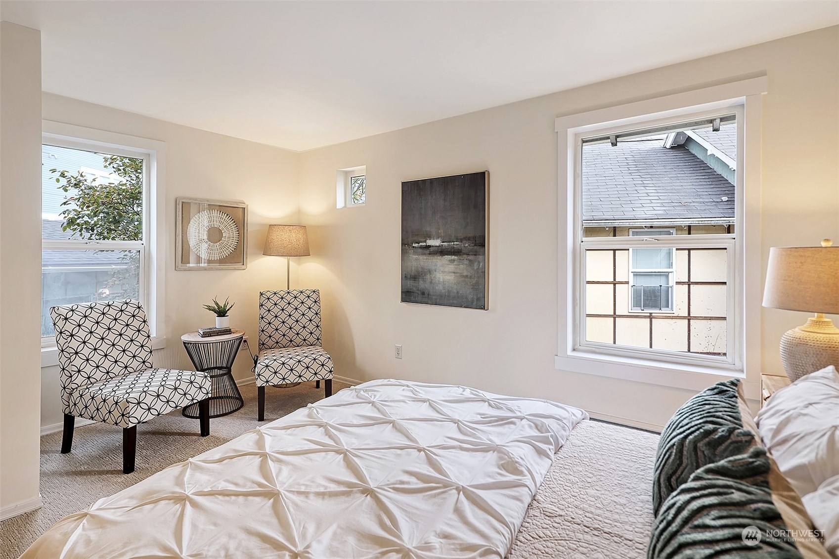 1817 20th Avenue, Unit B Seattle, WA 98122 - Photo 15 of 28 a bedroom with a bed and wooden floor