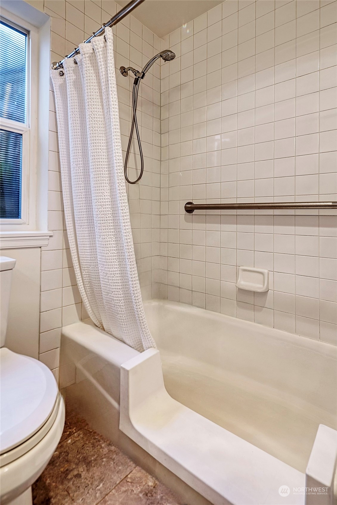 1817 20th Avenue, Unit B Seattle, WA 98122 - Photo 17 of 28 a white bath tub sitting next to a white toilet and sink