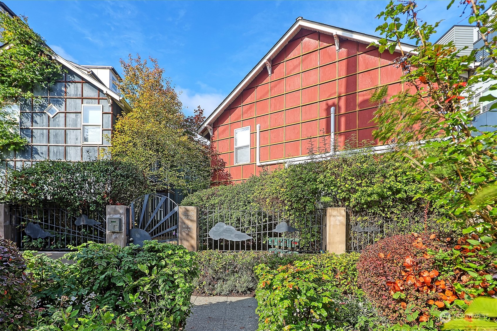 1817 20th Avenue, Unit B Seattle, WA 98122 - Photo 23 of 28 a view of a house with a yard and plants