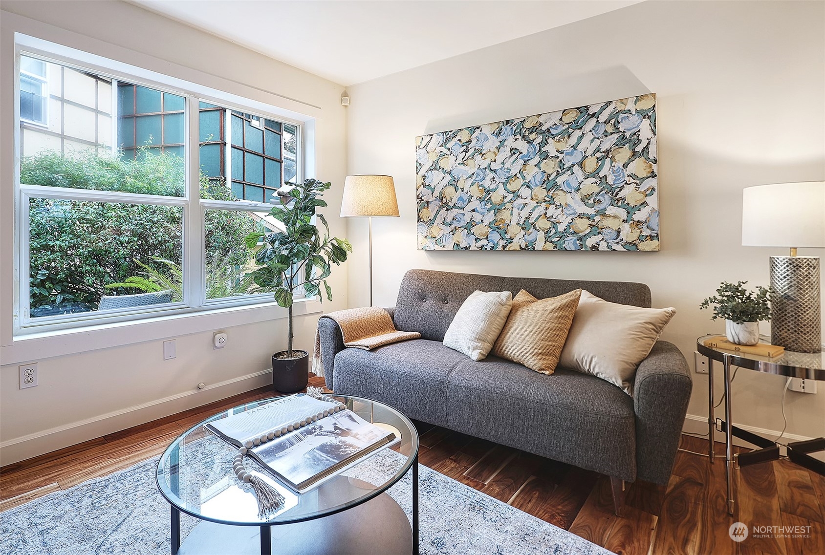 1817 20th Avenue, Unit B Seattle, WA 98122 - Photo 3 of 28 a living room with a large window and a table