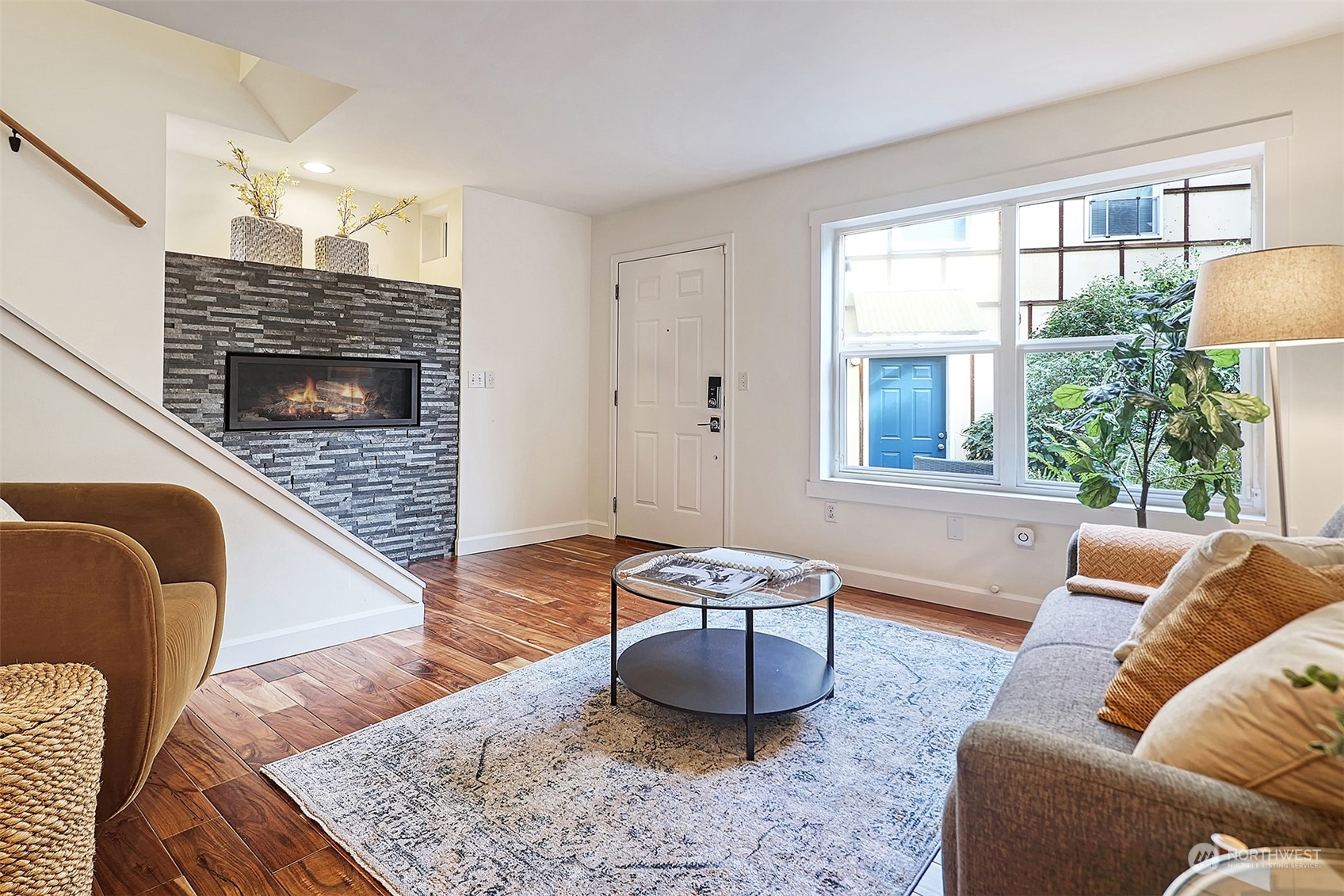 1817 20th Avenue, Unit B Seattle, WA 98122 - Photo 5 of 28 a living room with furniture rug and window