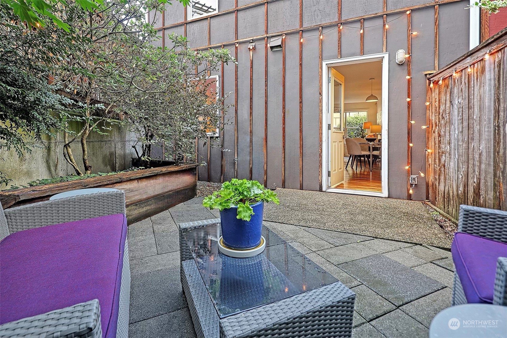 1817 20th Avenue, Unit B Seattle, WA 98122 - Photo 10 of 28 a view of a porch with chairs and potted plants