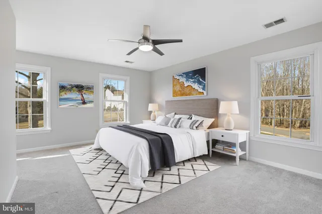 a bed room with a bed and a window