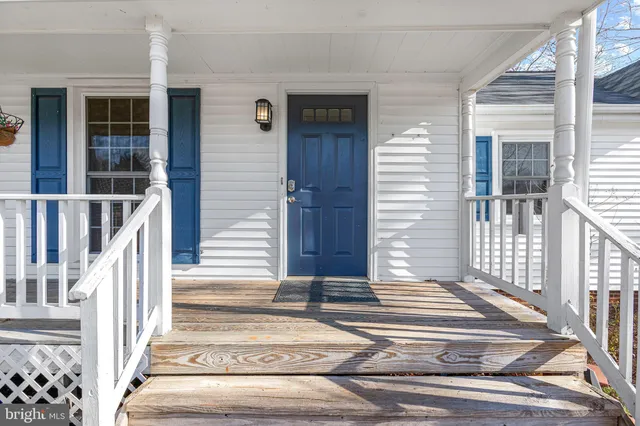 a view of a house with a door and wooden floor