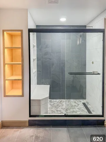 a view of bathroom with shower and wooden floor