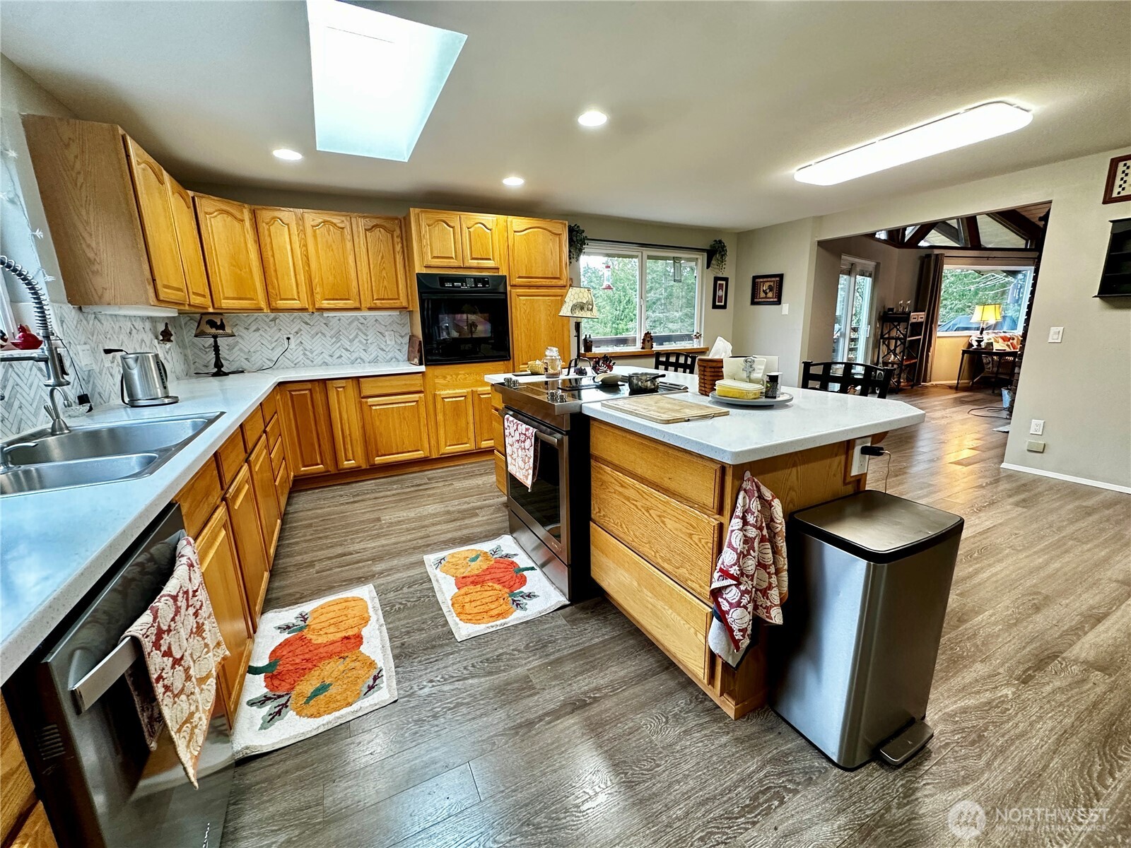364 Old Dads Road Sequim, WA 98382 - Photo 18 of 37 a kitchen with wooden cabinets and a sink