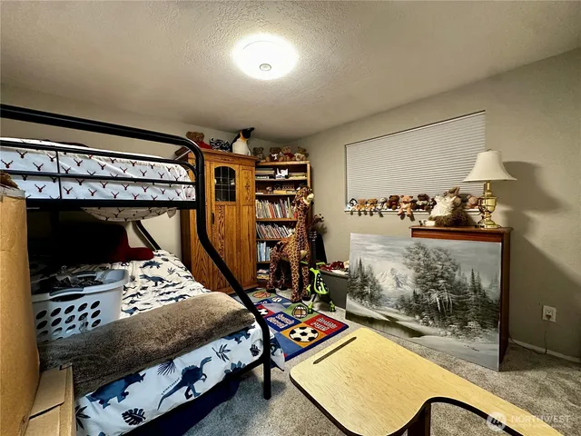 a room with furniture and gym equipment