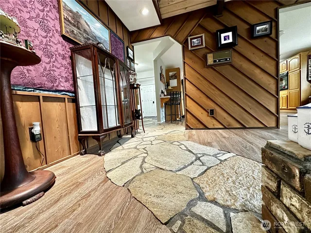 a view of a livingroom with furniture and staircase