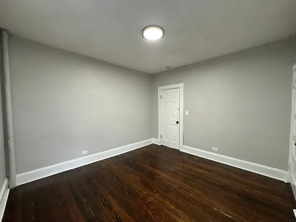 a bathroom with a toilet a sink and a mirror