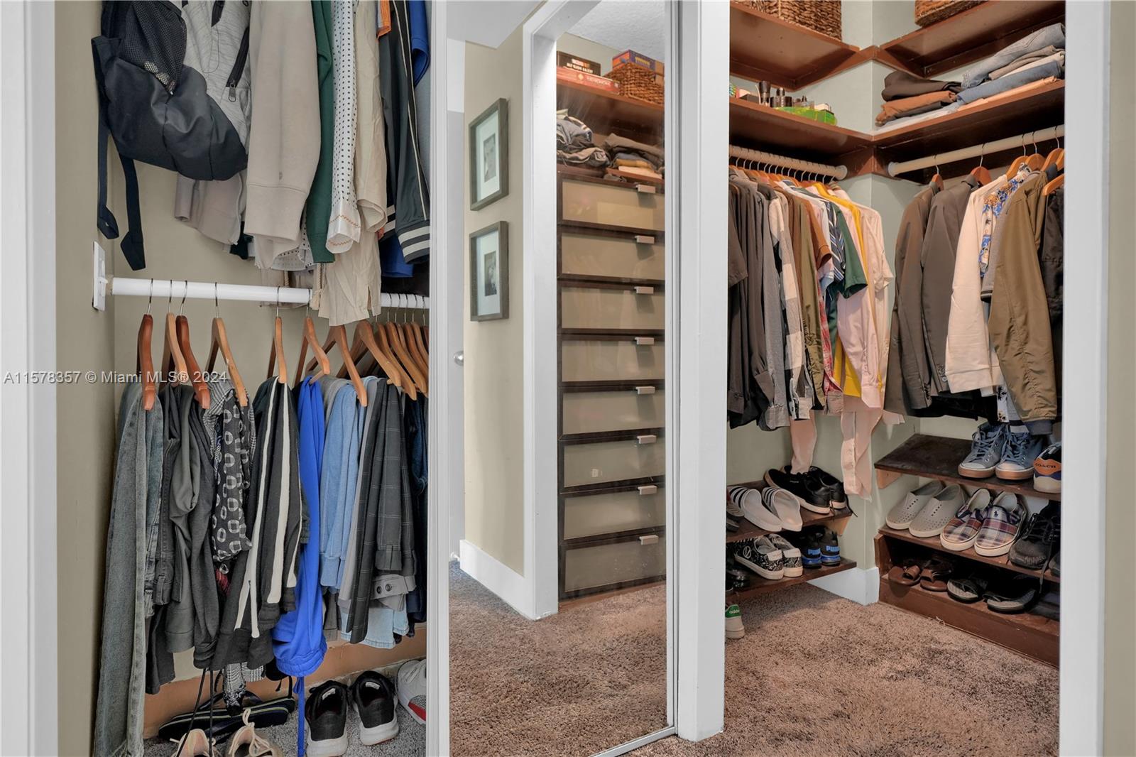 950 Hillcrest Drive, Unit 114 Hollywood, FL 33021 - Photo 17 of 24 a view of walk in closet with clothes and shoes