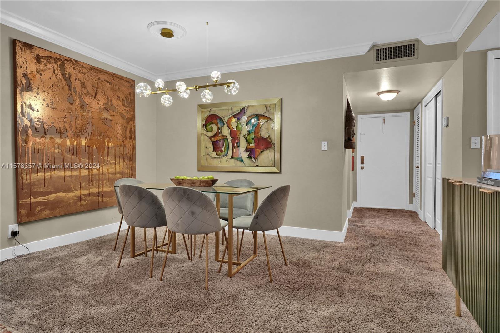 950 Hillcrest Drive, Unit 114 Hollywood, FL 33021 - Photo 5 of 24 a view of a dining room with furniture large window and glass door