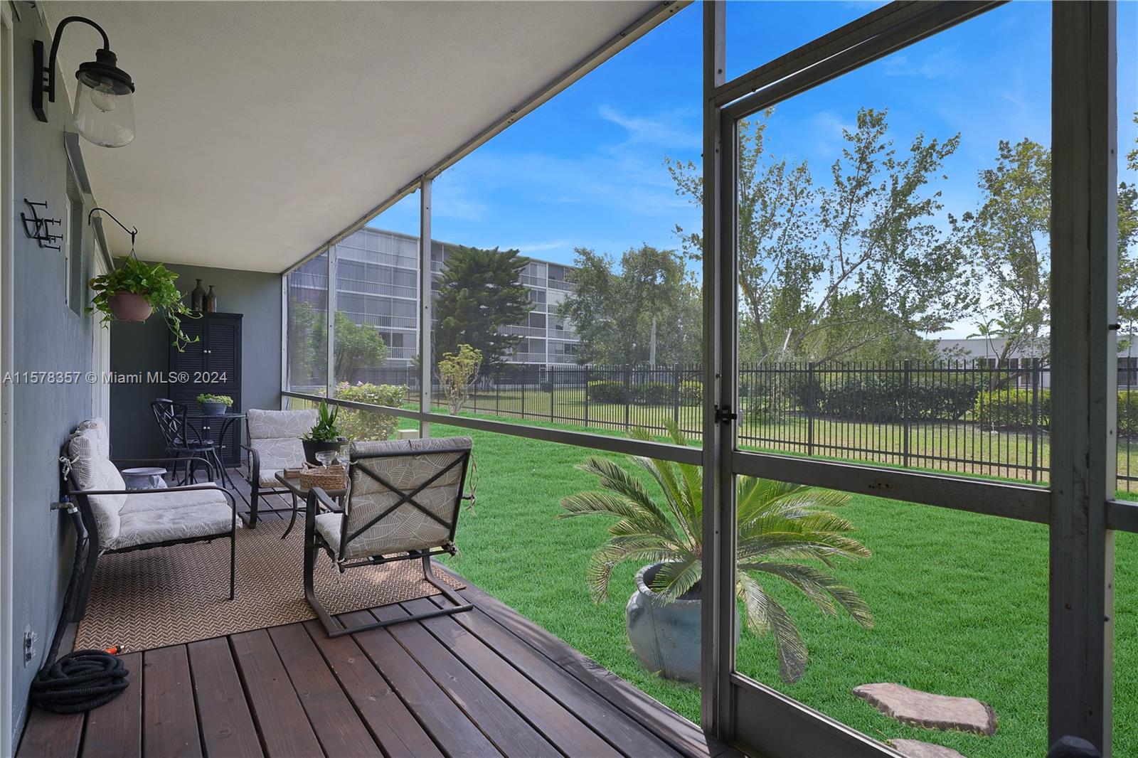 950 Hillcrest Drive, Unit 114 Hollywood, FL 33021 - Photo 8 of 24 a view of a floor to ceiling window and wooden floor