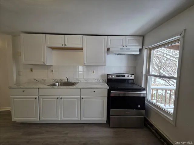 a kitchen with stainless steel appliances a stove and a refrigerator