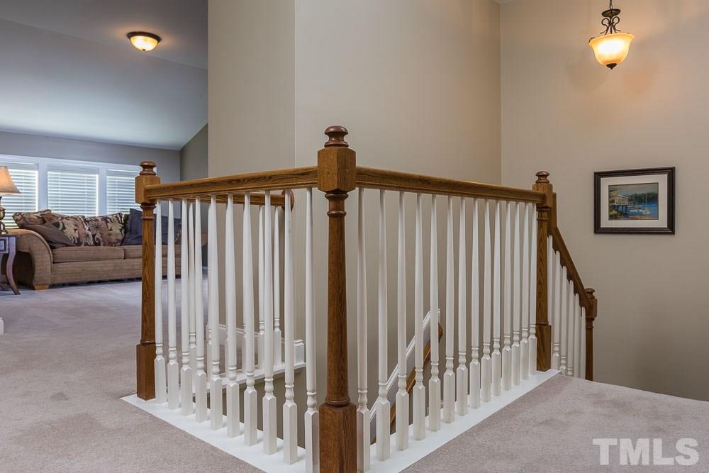 654 Democracy Street Raleigh, NC 27603 - Photo 18 of 24 a view of a livingroom with entryway and stairs