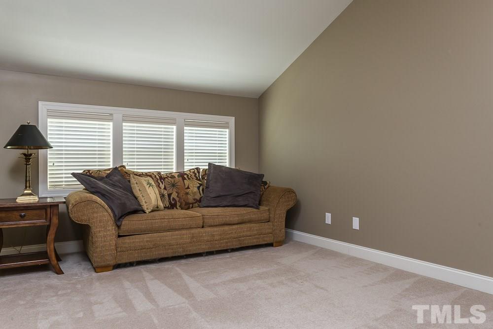 654 Democracy Street Raleigh, NC 27603 - Photo 19 of 24 a living room with furniture and a window