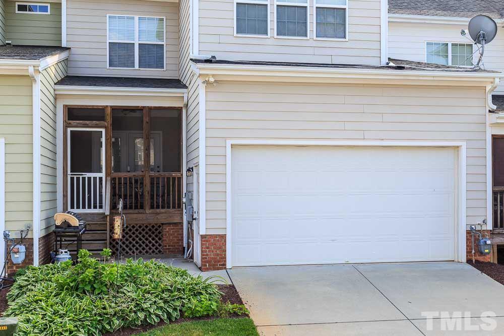 654 Democracy Street Raleigh, NC 27603 - Photo 23 of 24 a view of front door of house with stairs