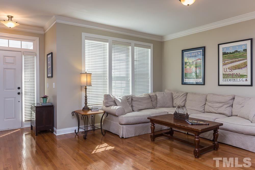 654 Democracy Street Raleigh, NC 27603 - Photo 5 of 24 a living room with furniture and a window