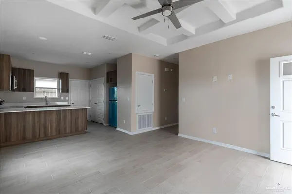 a view of a kitchen with a sink cabinets and window