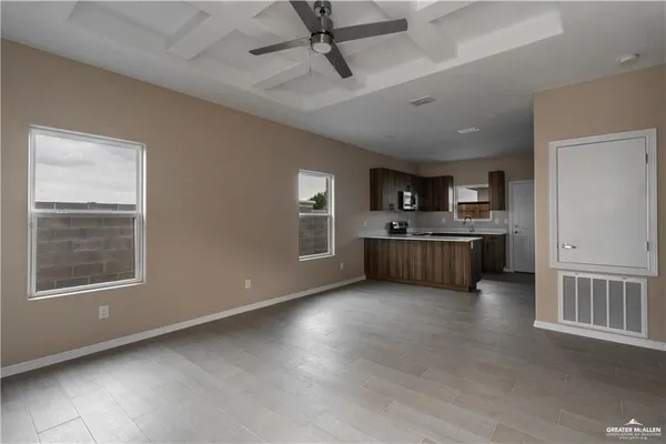 a view of a kitchen with microwave and cabinets