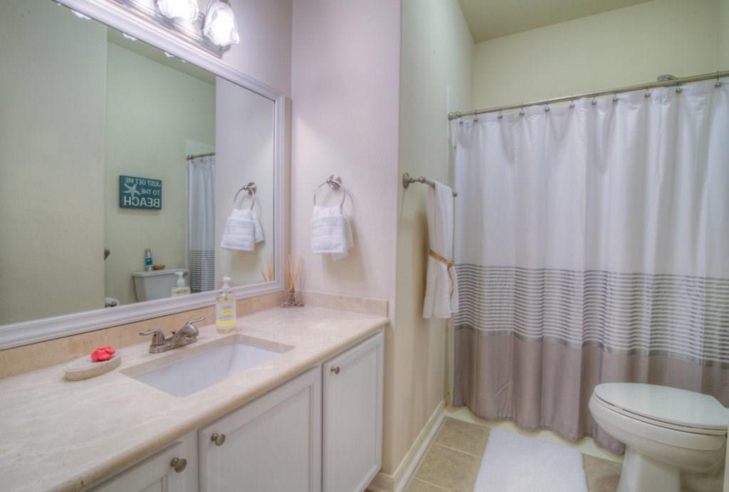 3454 Shiraz Loop Round Rock, TX 78665 - Photo 17 of 23 a bathroom with a sink a toilet and shower curtain