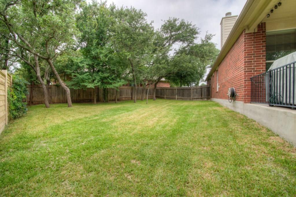 3454 Shiraz Loop Round Rock, TX 78665 - Photo 23 of 23 a view of a backyard with a small cabin
