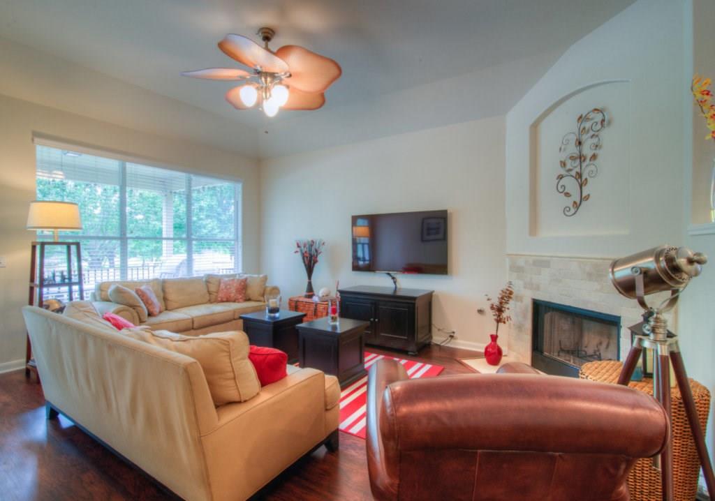 3454 Shiraz Loop Round Rock, TX 78665 - Photo 7 of 23 a living room with fireplace furniture and a flat screen tv