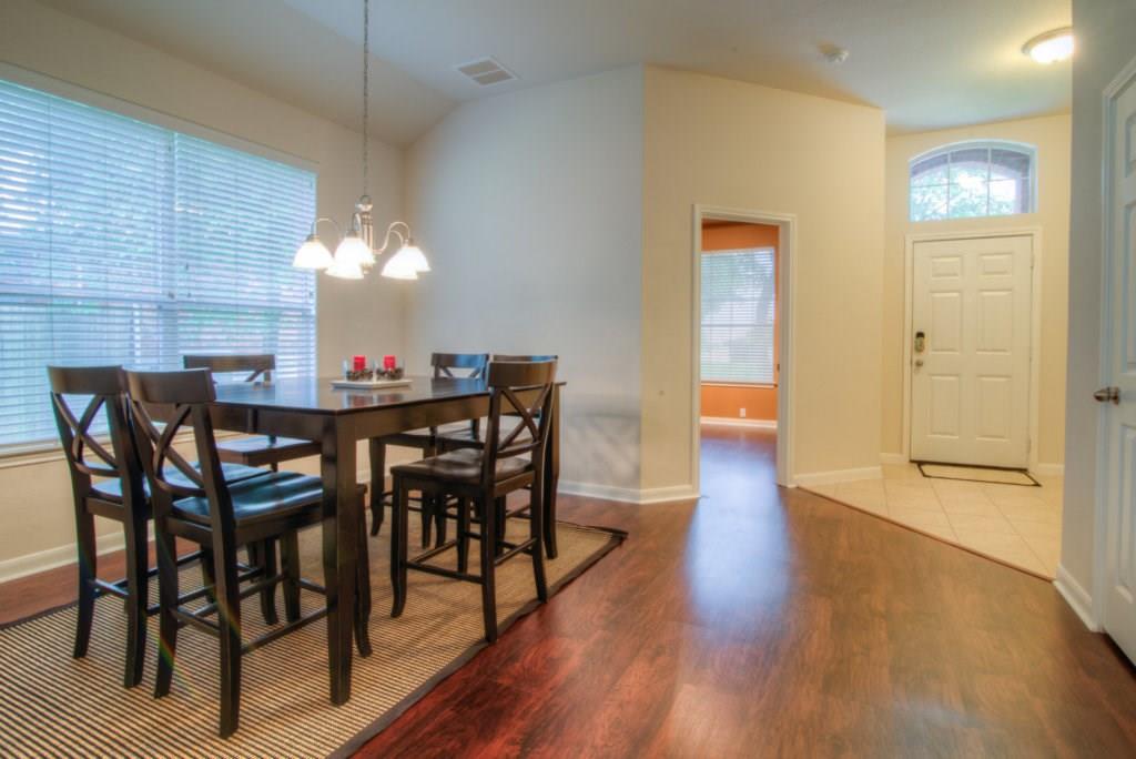 3454 Shiraz Loop Round Rock, TX 78665 - Photo 10 of 23 a view of a dining room with furniture and wooden floor