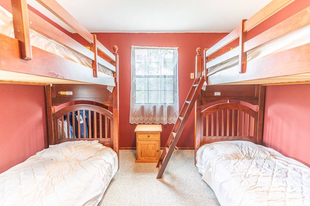 447-495 Blessing Lane Utopia, TX 78884 - Photo 14 of 24 a view of a bedroom with a bed and glass door