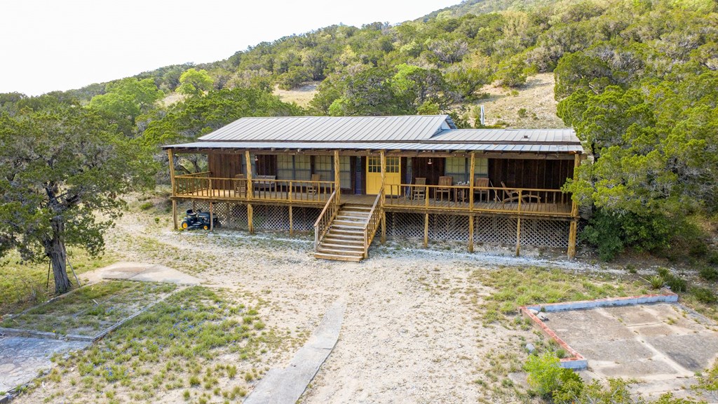 447-495 Blessing Lane Utopia, TX 78884 - Photo 17 of 24 a house with trees in the background