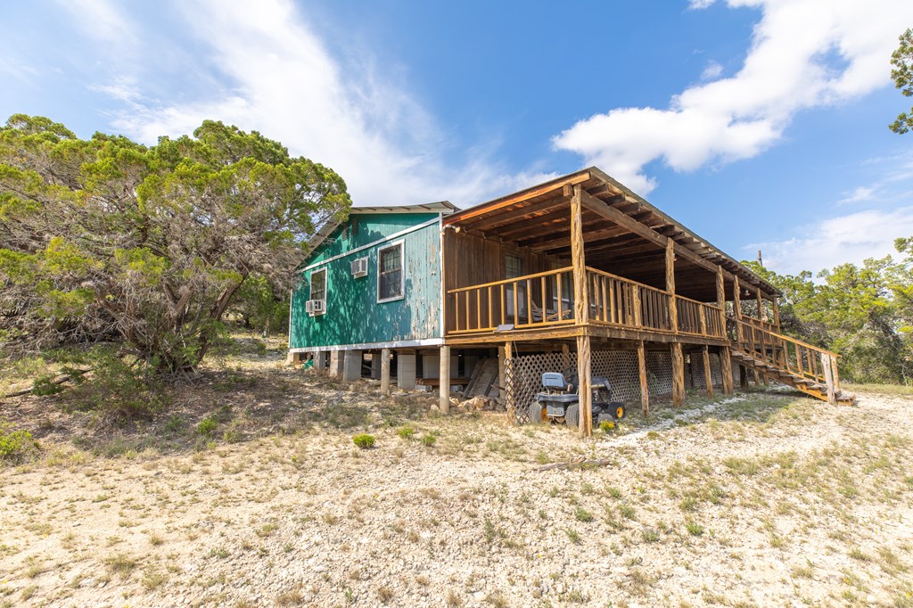 447-495 Blessing Lane Utopia, TX 78884 - Photo 19 of 24 a house with trees in front of it