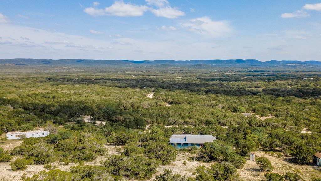 447-495 Blessing Lane Utopia, TX 78884 - Photo 24 of 24 a view of a lake with mountains in the background