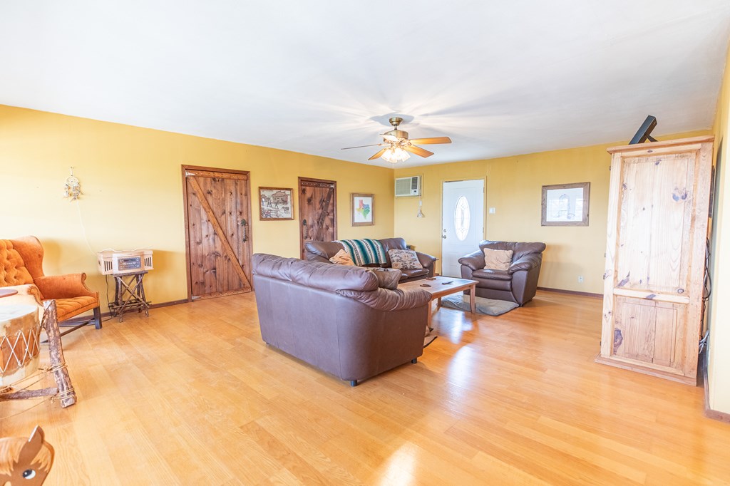 447-495 Blessing Lane Utopia, TX 78884 - Photo 5 of 24 a living room with furniture and a chandelier