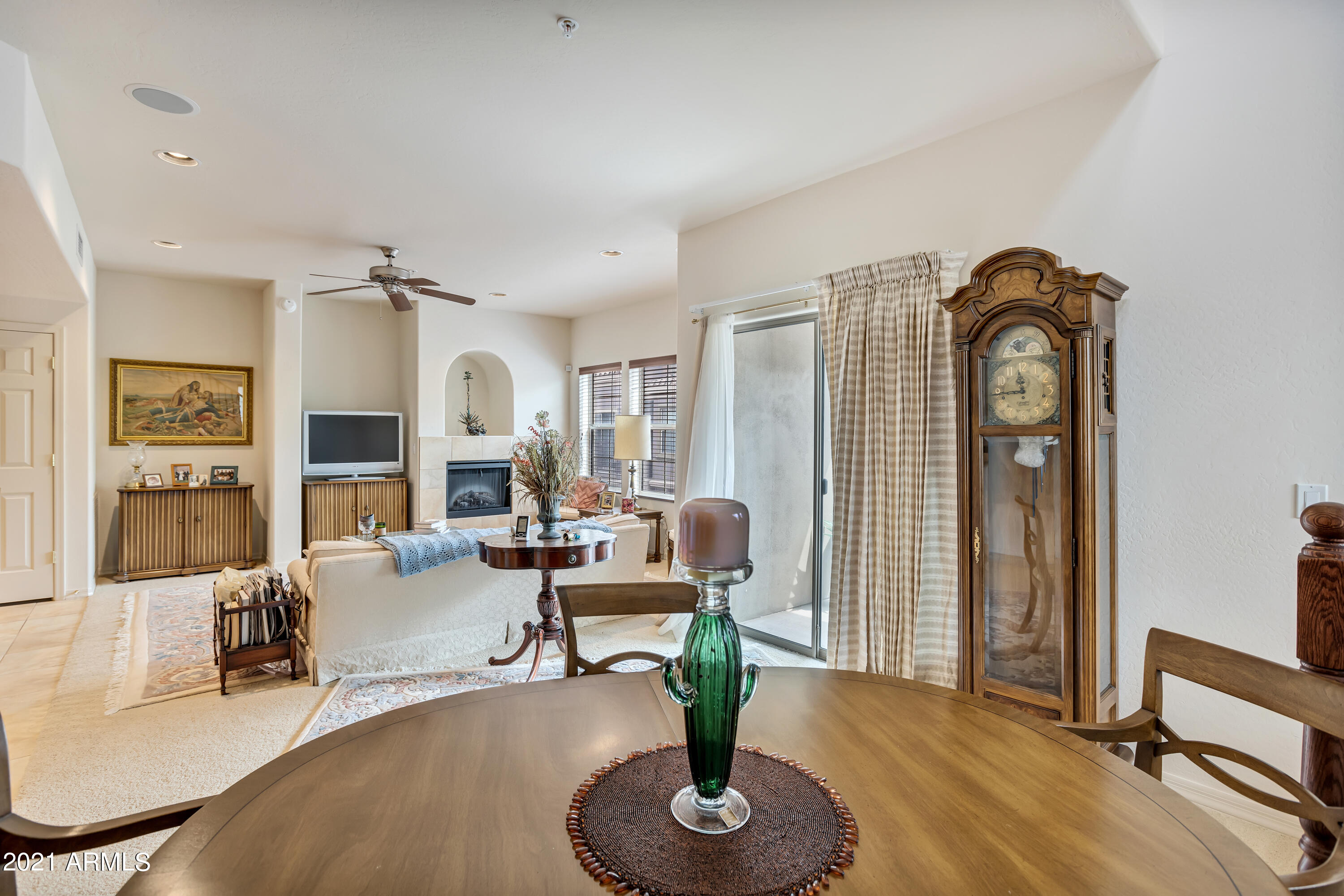 3935 East Rough Rider Road, Unit 1156 Phoenix, AZ 85050 - Photo 9 of 20 Dining into living room
