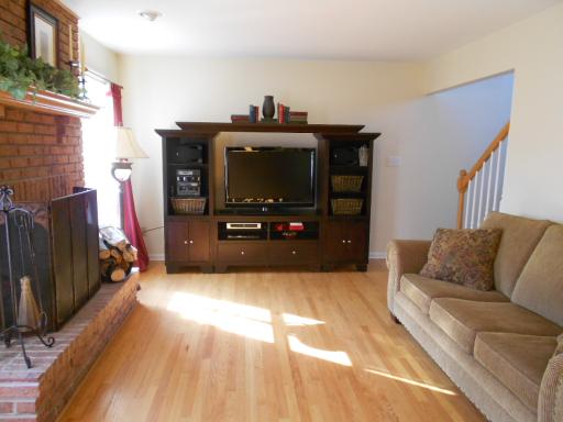 21143 Deerpath Road Frankfort, IL 60423 - Photo 6 of 16 a living room with furniture and a flat screen tv