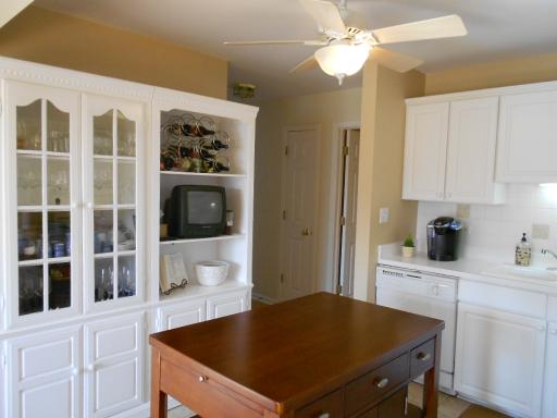21143 Deerpath Road Frankfort, IL 60423 - Photo 8 of 16 a kitchen with a table chairs and cabinets