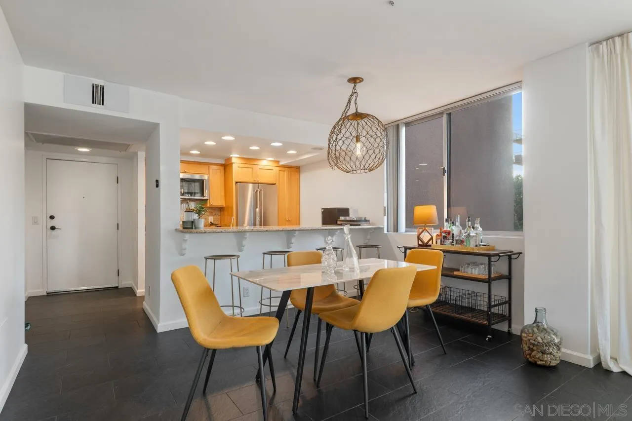 3635 7th Avenue, Unit 2D San Diego, CA 92103 - Photo 14 of 68 a view of a dining room with furniture and chandelier